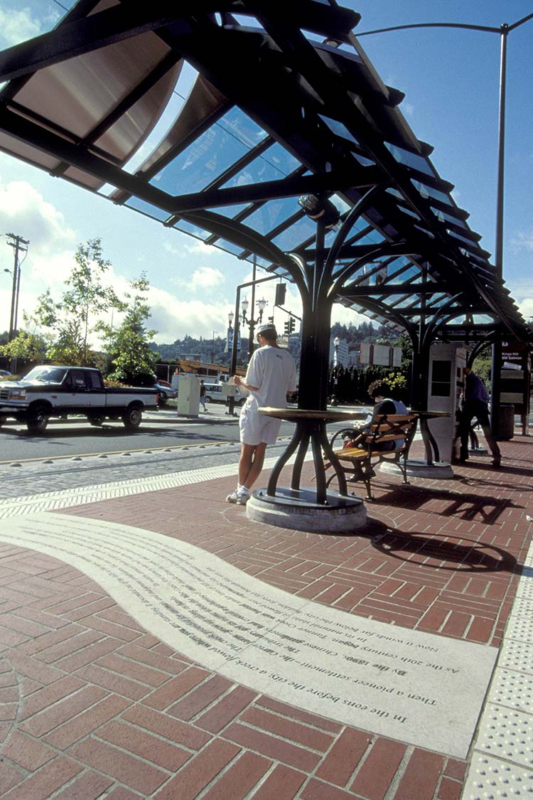 Shelter and platform on brick sidewalk