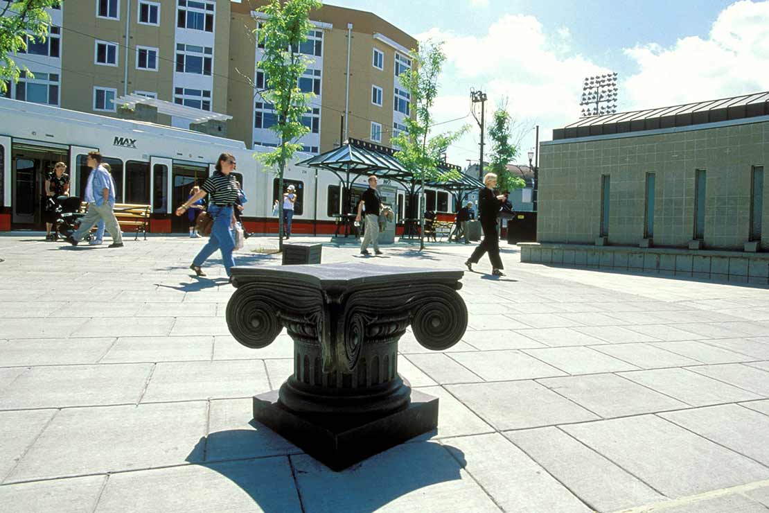 A large metal podium similar to the top of a Greek column