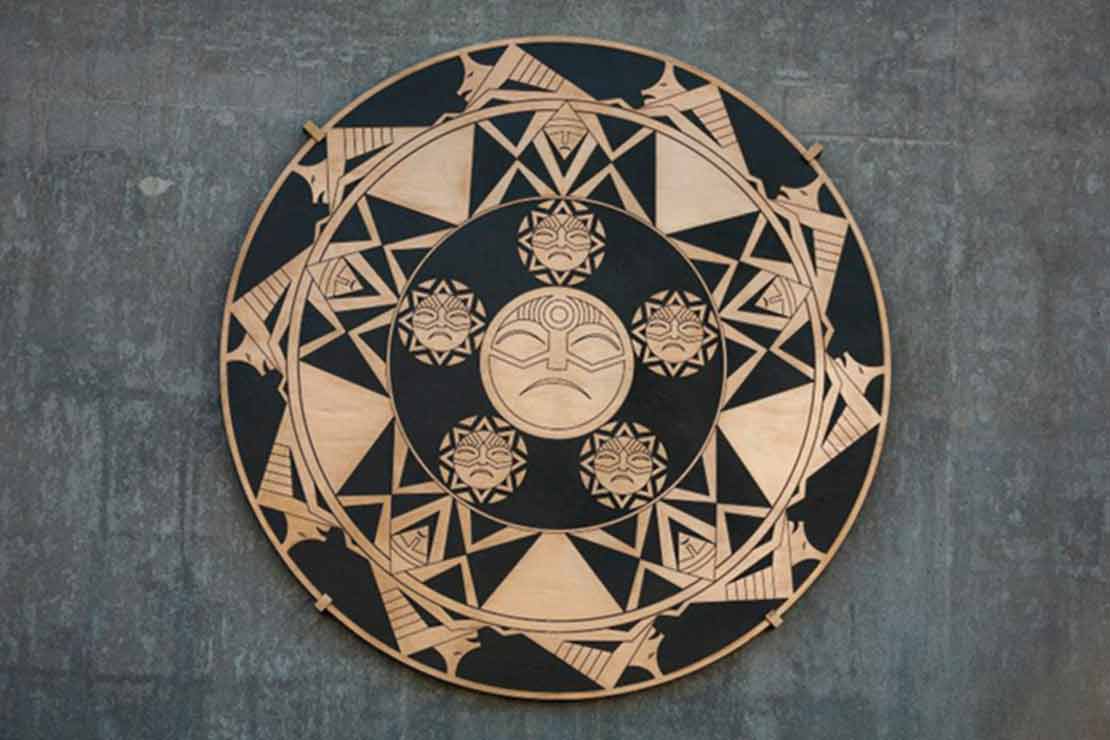 'We Have Always Lived Here' medallion - a detail on the sculpture