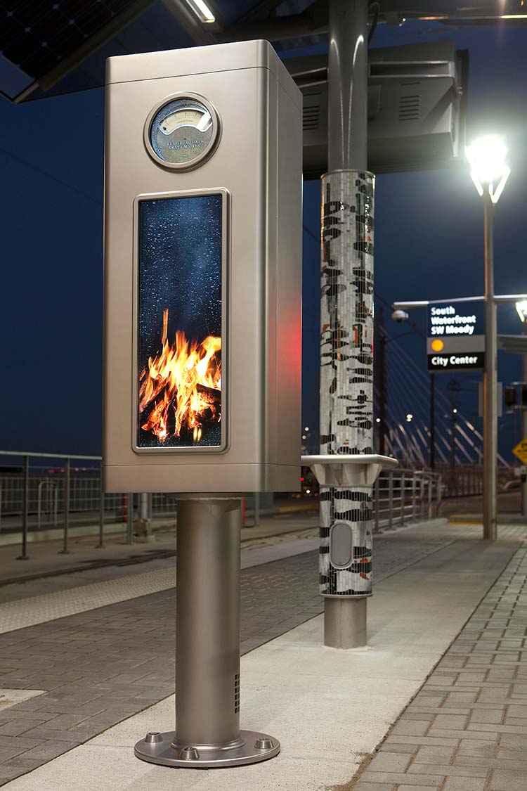 'Flooded Data Machine' sculpture - a box with flames inside on a pedastal