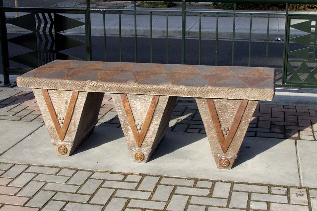 Bench with 3 large V-shaped legs in a row